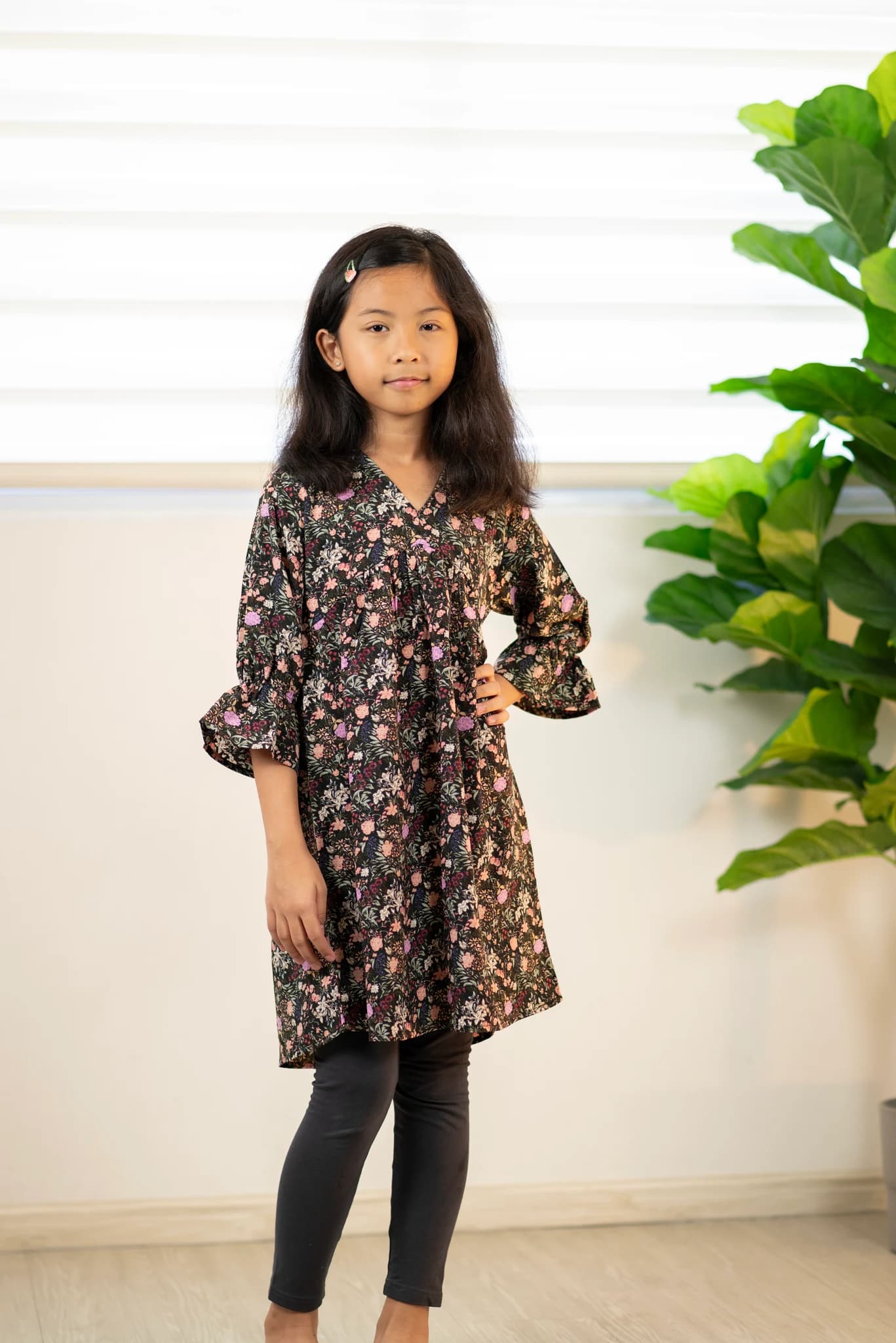 A girl in a floral Melrose dress